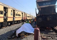 train passengers use their mobile phones to take photographs of a dead elephant after it was hit by a train in hojai district in the eastern state of assam india december 20 2025 reuters
