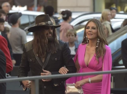 elizabeth hurley and billy ray cyrus stun as new couple goes official on red carpet elizabeth hurley and billy ray cyrus stun as new couple goes official on red carpet