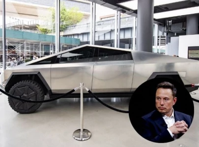 tesla cybertruck spotted towing giant elon musk statue in texas amid nft promotion