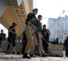police guard a road leading to red zone in peshawar on october 11 2026 photo reuters