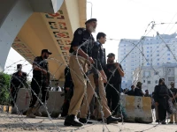 police guard a road leading to red zone in peshawar on october 11 2026 photo reuters