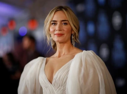 emily blunt wears bright orange armani gown for fall guy premier