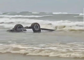 suv swept away by waves at sea view beach