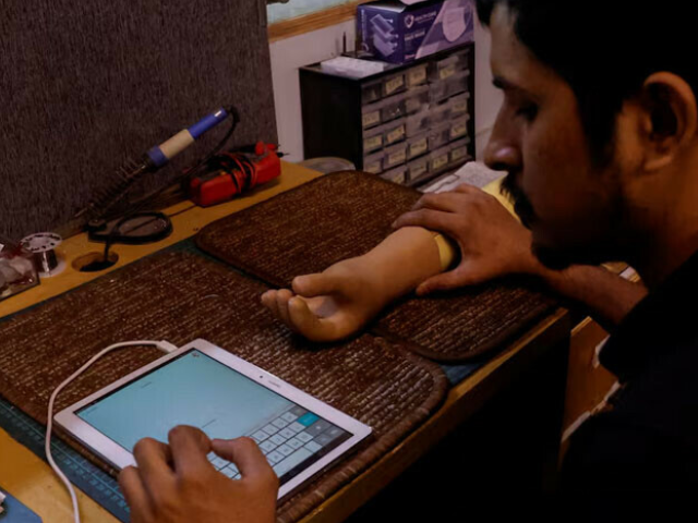 A technician checks a prosthetic limb at the Bioniks in Karachi, April 29, 2024. — Reuters
