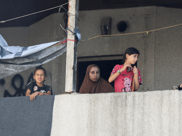 Palestinians look on at the site in the aftermath of an overnight Israeli strike on Al-Remal clinic where displaced people take shelter in Gaza City on July 7, 2025. — Reuters