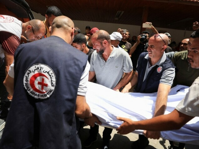 People carry the body of Palestinian Christian Saad Salama, who was killed in an Israeli strike on the Church of the Holy Family, at Al-Ahli Arab Hospital, in Gaza City. — Reuters