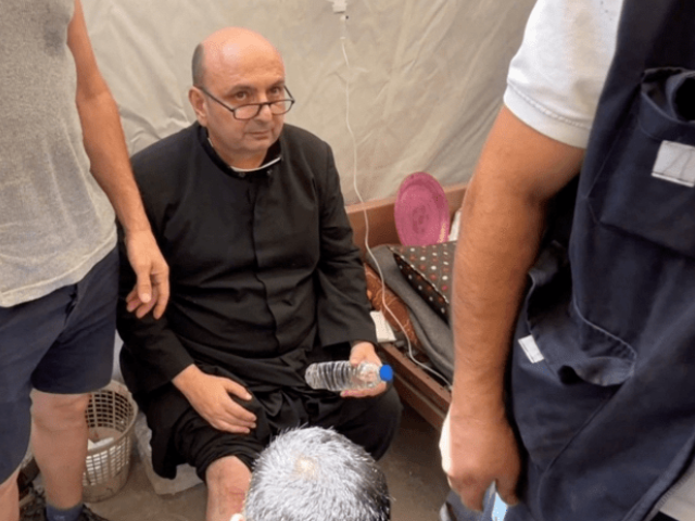 Parish priest of the Church of the Holy Family, father Gabriele Romanelli, receives medical attention after he suffered light leg injuries following an Israeli strike on the church, according to medics, at Al-Ahli Arab Hospital in Gaza City, in this still image taken from a video on July 17, 2025. — Reuters