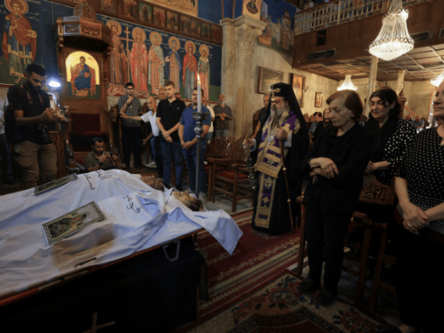 Archbishop Alexios stands in front of the bodies of Palestinian Christians Saad Salama and Foumia Ayyad, who were killed in an Israeli strike on the Holy Family Church, according to medics, as mourners attend their funeral at the Greek Orthodox Saint Porphyrius Church, in Gaza City on July 17, 2025. — Reuters