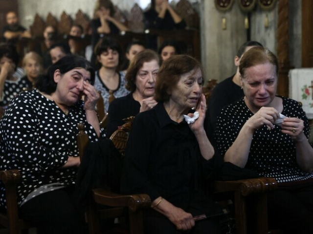 Christian Palestinian mourners attend the funeral ceremony of Saad Salameh and Foumia Ayyad, killed earlier in an Israeli strike that hit the Holy Family Church in Gaza City, at the Saint Porphyrius Church on July 17. — AFP