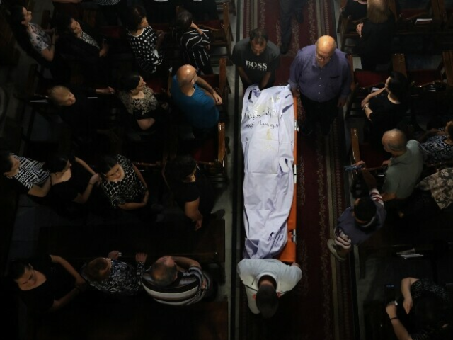 Christian Palestinian mourners attend the funeral ceremony of Saad Salameh and Foumia Ayyad, killed earlier in an Israeli strike that hit the Holy Family Church in Gaza City, at the Saint Porphyrius Church on July 17. — AFP