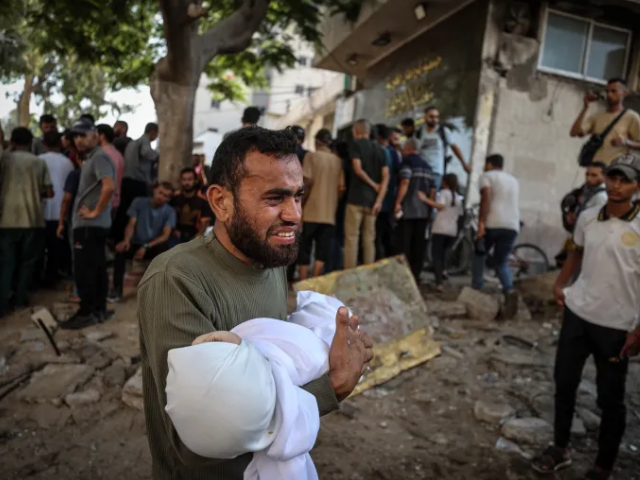 Bodies of Palestinians are brought to al-Shifa Hospital in Gaza City after an Israeli air raid [Ali Jadallah/Anadolu]