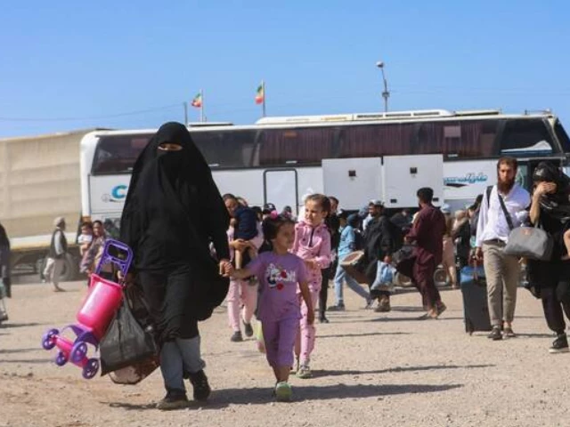 an iranian bus drops off afghan refugees at zero point on the islam qala border in herat province on july 24 2025 afp