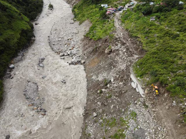 A drone view of an excavator, as it clears debris from a damaged road after a landslide in Bhatwadi village at Uttarkashi district of Uttarakhand, India, August 7, 2025. REUTERS