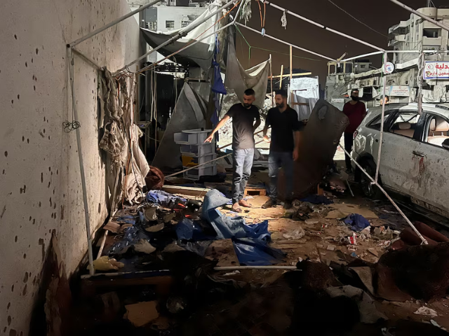 Palestinians inspect the site of an Israeli strike where Al Jazeera says its journalists Anas Al Sharif, Mohammed Qreiqeh and three photojournalists were killed, in Gaza City, August 11, 2025. REUTERS