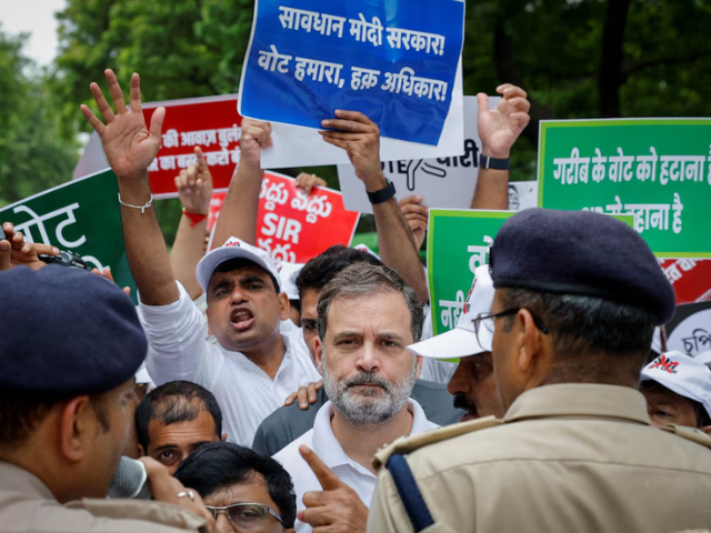 Rahul Gandhi, lawmaker and leader of India's main opposition Congress party, is stopped by police along with other lawmakers during a protest against what they say are electoral malpractices, in New Delhi, India, August 11, 2025. REUTERS
