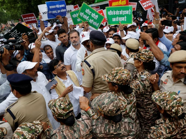 rahul gandhi a lawmaker and a leader of india s main opposition congress party is stopped by police along with other lawmakers during a protest against what they say are electoral malpractices in new delhi india august 11 2025 reuters