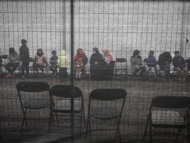 afghan refugees queue outside a distribution and donation center at liberty village on joint base mcguire dix lakehurst in new jersey u s december 2 2021 reuters barbara davidson pool file photo afghan refugees queue outside a distribution and donation center at liberty village on joint base mcguire dix lakehurst in new jersey u s december 2 2021 reuters barbara davidson pool file photo