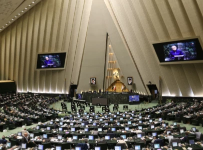 iran s parliament passes bill to halt cooperation with iaea