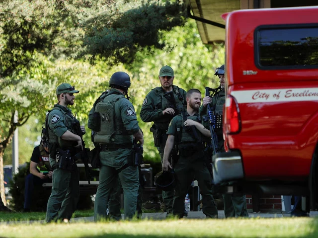law enforcement officers gather at cherry hill park after multiple firefighters were attacked when responding to a fire in the canfield mountain area outside coeur d alene idaho u s june 29 2025 reuters young kwak law enforcement officers gather at cherry hill park after multiple firefighters were attacked when responding to a fire in the canfield mountain area outside coeur d alene idaho u s june 29 2025 reuters young kwak