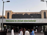 passengers wait outside at jinnah international airport after all domestic and international flights were cancelled in karachi on may 7 2025 photo afp passengers wait outside at jinnah international airport after all domestic and international flights were cancelled in karachi on may 7 2025 photo afp