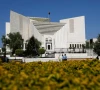 police officers walk past the supreme court of pakistan building in islamabad pakistan april 6 2022 reuters police officers walk past the supreme court of pakistan building in islamabad pakistan april 6 2022 reuters