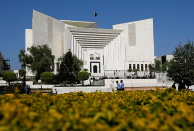 police officers walk past the supreme court of pakistan building in islamabad pakistan april 6 2022 reuters