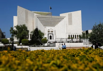police officers walk past the supreme court of pakistan building in islamabad pakistan april 6 2022 reuters