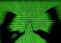 silhouettes of laptop users are seen next to a screen projection of binary code are seen in this picture illustration created on march 28 2018 reuters