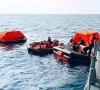 sri lanka navy personnel assist iranian sailors during a rescue operation after responding to a distress call from their vessel the iranian military ship iris dena while at sea within sri lanka s maritime search and rescue region in indian ocean sri lanka march 4 2026 sri lanka navy handout via reuters