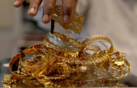 a goldsmith weighs gold jewellery inside a showroom in ahmedabad reuters a goldsmith weighs gold jewellery inside a showroom in ahmedabad reuters