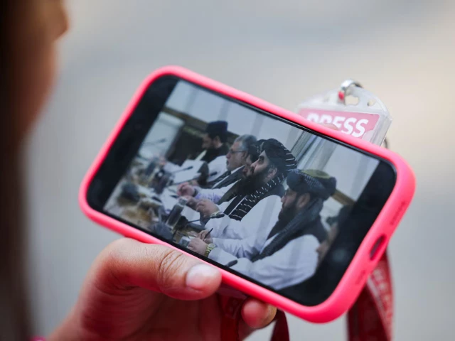 a journalist watches the live streaming of talks between afghanistan s foreign minister amir khan muttaqi and india s foreign minister s jaishankar on her phone outside hyderabad house in new delhi india october 10 2025 reuters a journalist watches the live streaming of talks between afghanistan s foreign minister amir khan muttaqi and india s foreign minister s jaishankar on her phone outside hyderabad house in new delhi india october 10 2025 reuters