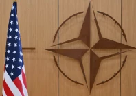 this photo shows the logo of the north atlantic treaty organisation nato and the us flag prior to a meeting by the us special envoy for ukraine and the nato secretary general to address the ongoing war in ukraine at nato headquarters in brussels belgium photo reuters