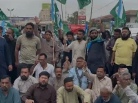 ji began a protest at natha khan bridge on shahrah e faisal in karachi photo express