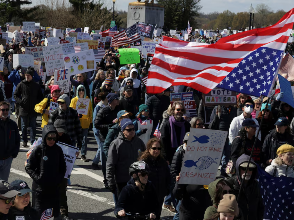 Demonstrators participate in a