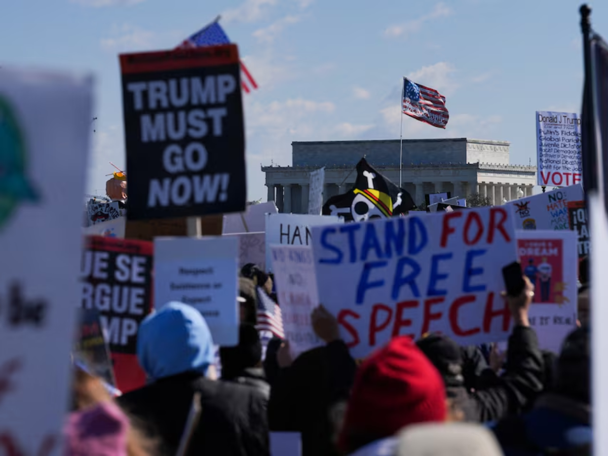 Demonstrators attend a