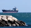 an oil tanker anchors near the oil hub of the port of fos lavera at sunset near marseille southern france photo reuters