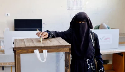 a palestinian woman votes during the municipal election at a polling station in deir al balah central gaza photo reuters