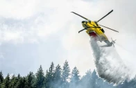 a helicopter drops water on the brunswick complex wildfires near north bend british columbia canada photo reuters