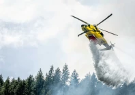 a helicopter drops water on the brunswick complex wildfires near north bend british columbia canada photo reuters