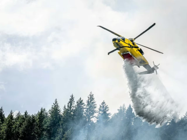 a helicopter drops water on the brunswick complex wildfires near north bend british columbia canada photo reuters a helicopter drops water on the brunswick complex wildfires near north bend british columbia canada photo reuters