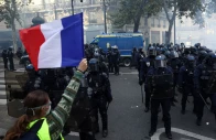 a protester wearing a yellow vest holds a french flag in front of french riot police amid clashes during a day of demonstrations against the cost of living and rising fuel prices in paris as part of nationwide protests called by the yellow vests movement joined by french high school and university students teachers and parents demanding better school conditions and government action as well as labour unions workers farmers and retirees france photo reuters a protester wearing a yellow vest holds a french flag in front of french riot police amid clashes during a day of demonstrations against the cost of living and rising fuel prices in paris as part of nationwide protests called by the yellow vests movement joined by french high school and university students teachers and parents demanding better school conditions and government action as well as labour unions workers farmers and retirees france photo reuters