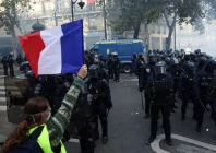 a protester wearing a yellow vest holds a french flag in front of french riot police amid clashes during a day of demonstrations against the cost of living and rising fuel prices in paris as part of nationwide protests called by the yellow vests movement joined by french high school and university students teachers and parents demanding better school conditions and government action as well as labour unions workers farmers and retirees france photo reuters a protester wearing a yellow vest holds a french flag in front of french riot police amid clashes during a day of demonstrations against the cost of living and rising fuel prices in paris as part of nationwide protests called by the yellow vests movement joined by french high school and university students teachers and parents demanding better school conditions and government action as well as labour unions workers farmers and retirees france photo reuters