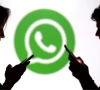 teenagers pose for a photo while holding smartphones in front of a whatsapp logo in this illustration photo reuters