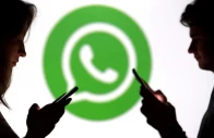 teenagers pose for a photo while holding smartphones in front of a whatsapp logo in this illustration photo reuters