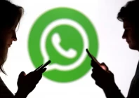 teenagers pose for a photo while holding smartphones in front of a whatsapp logo in this illustration photo reuters