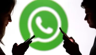 teenagers pose for a photo while holding smartphones in front of a whatsapp logo in this illustration photo reuters