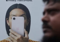 a man walks past an apple iphone hoarding on a street in mumbai india photo reuters