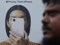 a man walks past an apple iphone hoarding on a street in mumbai india photo reuters