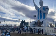 people gather by a statue of argentina s revered lionel messi while watching the world cup semi finals between argentina and england in cutral co in the patagonian province of neuquen argentina photo reuters