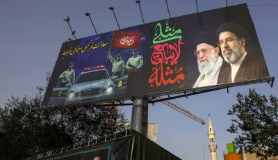 a billboard depicting iran s late supreme leader ayatollah ali khamenei and iran s supreme leader ayatollah mojtaba khamenei at valiasr square in tehran iran photo reuters